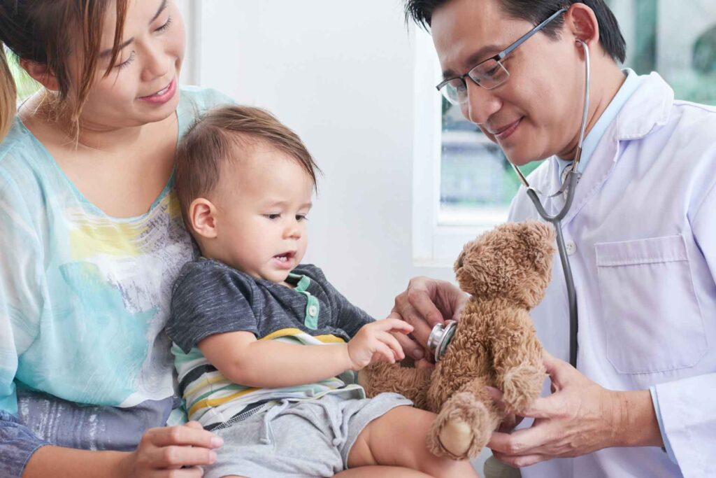 Primary care doctor with mother and child