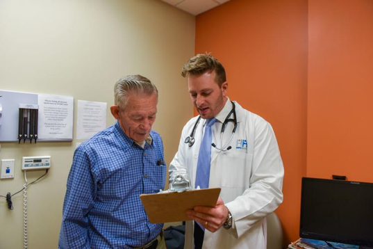doctor performing a checkup on a patient